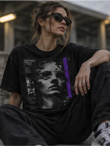 Model seated in the Anonymous Subject tee